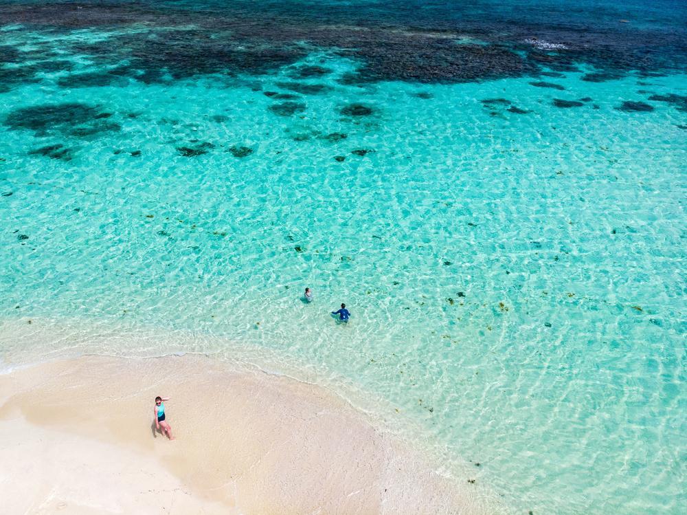 Fotos de férias: Foto aérea de pessoas na praia